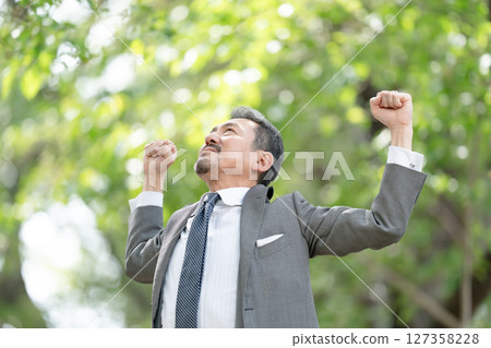 Businessman portrait fresh green growth 127358228