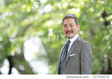 Businessman portrait fresh green Businessman portrait fresh green 127358270