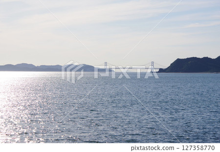 View of the Onaruto Bridge from Higashimachi Beach in Minamiawaji City, Hyogo Prefecture 127358770
