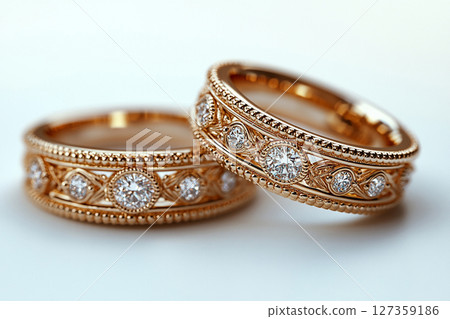 Luxury pair of Wedding Rings on a white background. Rococo Renaissance style. 127359186