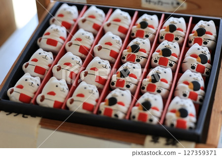 Lucky cat fortune slips for sale at Mitsuke Tenjin Shrine in Iwata, Shizuoka Prefecture Lucky cat fortune slips for sale at Mitsuke Tenjin Shrine in Iwata, Shizuoka Prefecture 127359371