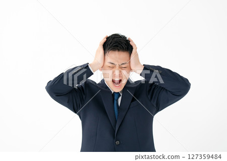 Young male business holding head Young male business holding head 127359484