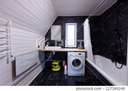Stylish Modern Bathroom Featuring Elegant Design Elements and Functional Appliances in a Contemporary Space with Modern Finishes and Textures Stylish Modern Bathroom Featuring Elegant Design Elements and Functional Appliances in a Contemporary Space with Modern Finishes and Textures 127360240