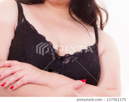 Big woman in underwear with arms folded Big woman in underwear with arms folded 127361175