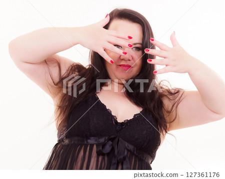 Adult plus size woman showing red nails. Adult plus size woman showing red nails. 127361176