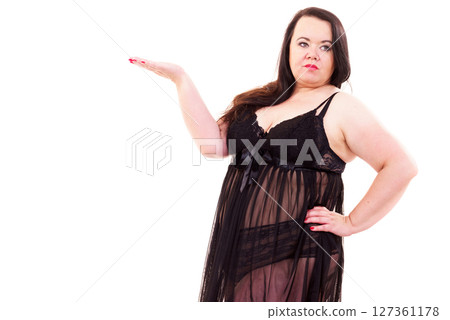 Woman plus size in lingerie holds open hand Woman plus size in lingerie holds open hand 127361178