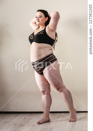 Plus size model wearing black lingerie 127361205