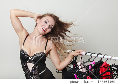Expressive sexy lady with collection of lingerie. 127361360