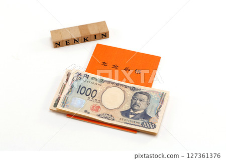 Pension book and banknote image 127361376