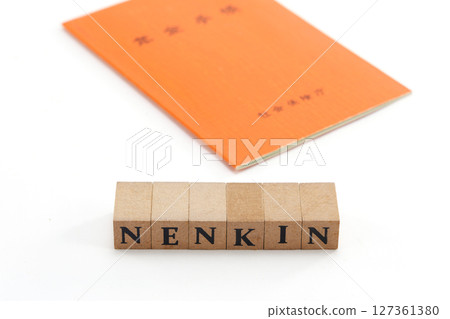 Pension book and banknote image 127361380