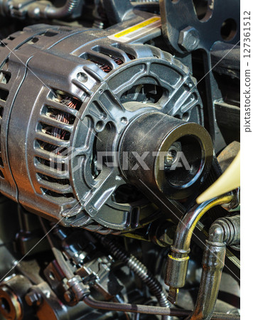 Detailed closeup of alternator generator machine engine Detailed closeup of alternator generator machine engine 127361512