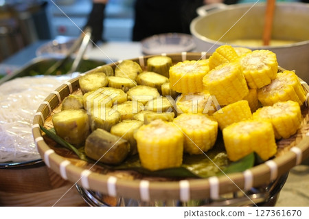 Corn pieces Steamed sweet potato or Shakhar Kandi in a plate. Steamed root sweet potato. Corn pieces Steamed sweet potato or Shakhar Kandi in a plate. Steamed root sweet potato. 127361670