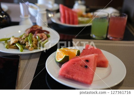 Green beans meat fresh fruit, including vibrant watermelon slices and a variety of ripe fruits in a bowl, promoting healthy eating. Green beans meat fresh fruit, including vibrant watermelon slices and a variety of ripe fruits in a bowl, promoting healthy eating. 127361716