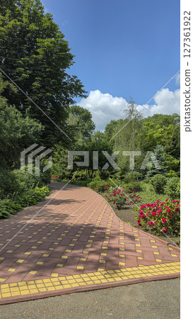 Park area with trees and flowers. Recreation areas and bicycle paths. Tourism Park area with trees and flowers. Recreation areas and bicycle paths. Tourism 127361922