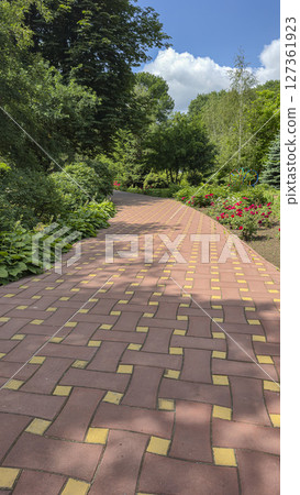 Park area with trees and flowers. Recreation areas and bicycle paths. Tourism 127361923