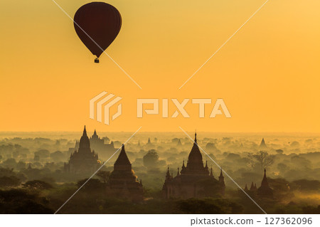 Balloon over plain of Bagan in misty morning, Myanmar Balloon over plain of Bagan in misty morning, Myanmar 127362096