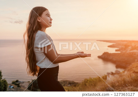 Girl Looking at the Sunset over the Sea Girl Looking at the Sunset over the Sea 127363127