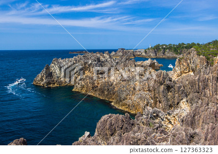 [Niigata Prefecture_Senkaku Bay] Rough cliffs created by erosion by rough waves over tens of thousands of years Spring 127363323