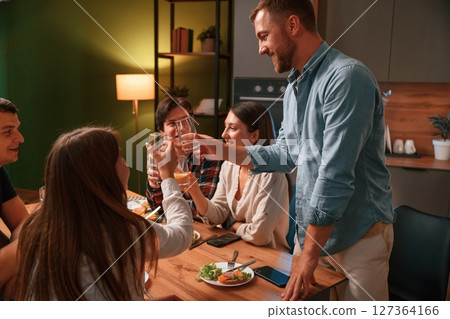 Group of people are on the kitchen, having dinner, spending time together 127364166