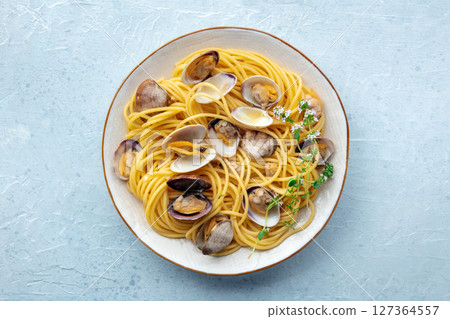 Vongole clams with spaghetti pasta, overhead flat lay shot. Seafood dish Vongole clams with spaghetti pasta, overhead flat lay shot. Seafood dish 127364557
