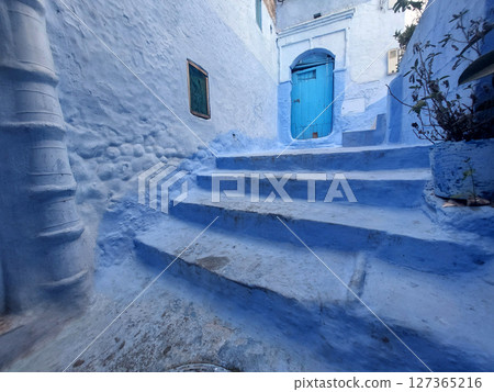 Streets and houses of Chefchaouen, Morocco painted in blue 127365216