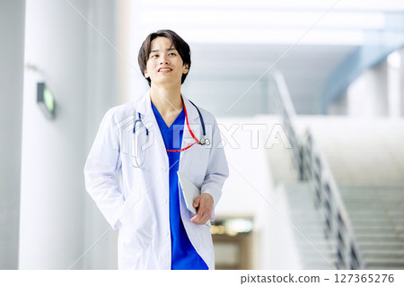 Young doctor working in a hospital Young doctor working in a hospital 127365276