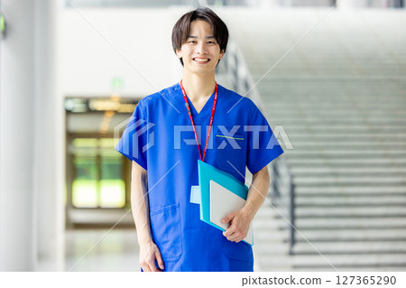 Young doctor working in a hospital 127365290