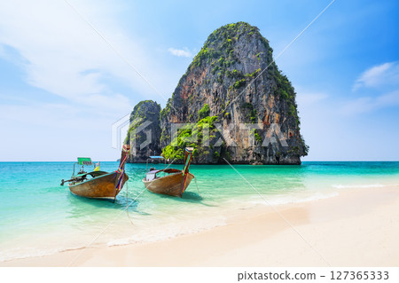 Amazing view of Ao Phra Nang Beach with thai traditional wooden longtail boat, white sand and turquoise sea in Krabi province. Ao Nang, Thailand. 127365333
