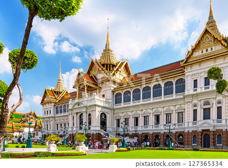 Amazing Royal grand palace in sunny day in Bangkok, Thailand. Chakri Maha Prasat Throne Hall at the Grand Palace in Bangkok. Amazing Royal grand palace in sunny day in Bangkok, Thailand. Chakri Maha Prasat Throne Hall at the Grand Palace in Bangkok. 127365334