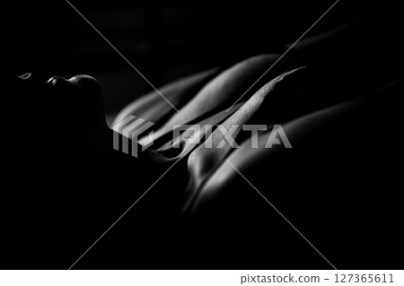 Part of a naked female body close-up. Body-positivity, self-love, acceptance. Concept of femininity and body care 127365611