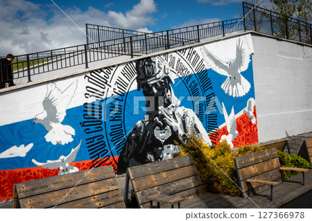 Kaliningrad peace mural with pigeons and soldier. Russian flag. Russia. 127366978