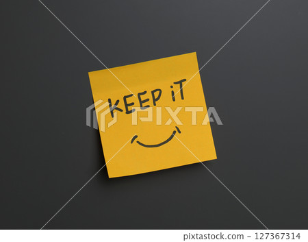 Positive reminder on sticky note in a minimal setting. High quality photo 127367314