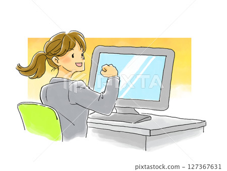 A woman laughing and giving a fist pump in front of a monitor A woman laughing and giving a fist pump in front of a monitor 127367631