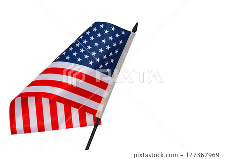 Stars striped blue red white flag of United States with black plastic post tilted forward and with curved canvas wriggling in wind is isolated on white background. Blank for holidays art works 127367969