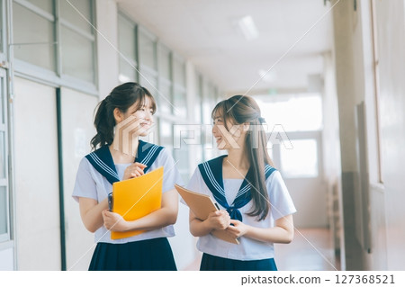 High school girl walking in the school corridor High school girl walking in the school corridor 127368521