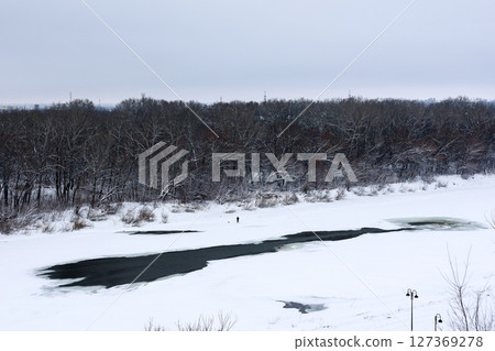 Melting Ice in the Middle of the River: A Beautiful Transition from Winter to Spring 127369278