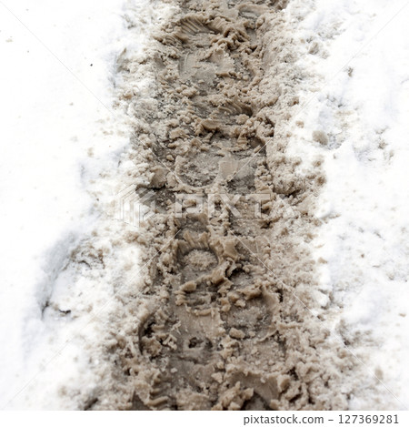 Spring Thaw: Human Footprints in Melting Snow, Capturing the Essence of Seasonal Transition Spring Thaw: Human Footprints in Melting Snow, Capturing the Essence of Seasonal Transition 127369281