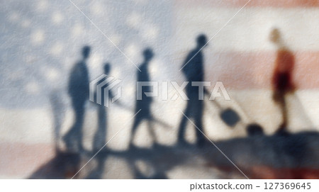 Shadow silhouettes of various workers are cast on an American flag, celebrating Labor Day and hard work 127369645