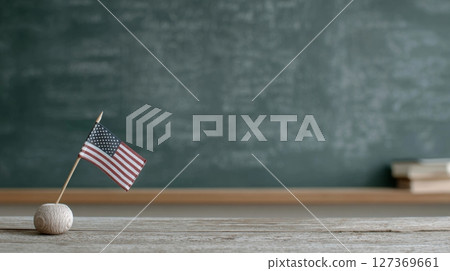 Small American flag on wooden table with chalkboard background for Labor Day celebration Small American flag on wooden table with chalkboard background for Labor Day celebration 127369661