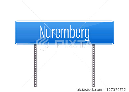 A blue signpost reads 'Nuremberg' in white lettering against a white background. 127370712