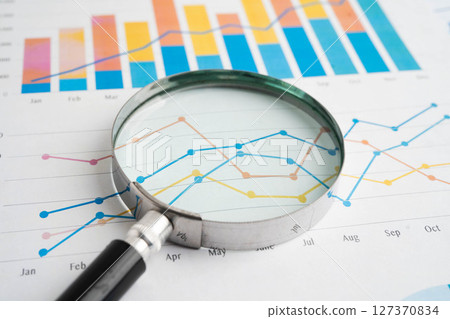 Magnifying glass on graph paper. Magnifying glass on graph paper. 127370834