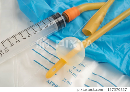 Foley catheter and urine drainage bag collect urine for disability or patient in hospital. 127370837