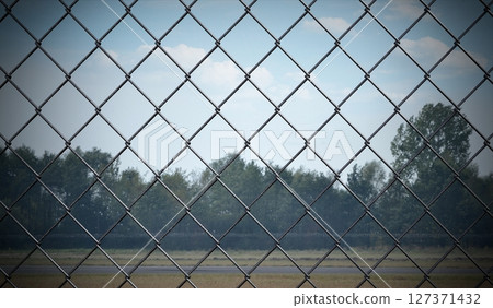 Mesh wire fence - 3d illustration 127371432