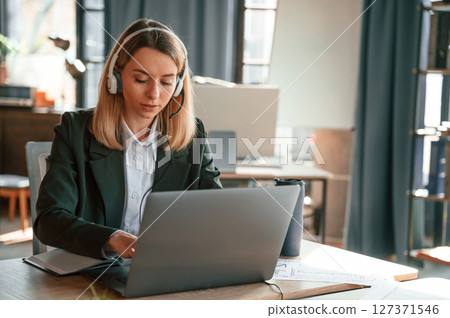 Young beautiful woman in formal clothes is working in the office 127371546