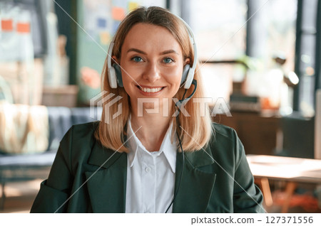 Portrait of young beautiful woman in formal clothes that is working in the office Portrait of young beautiful woman in formal clothes that is working in the office 127371556
