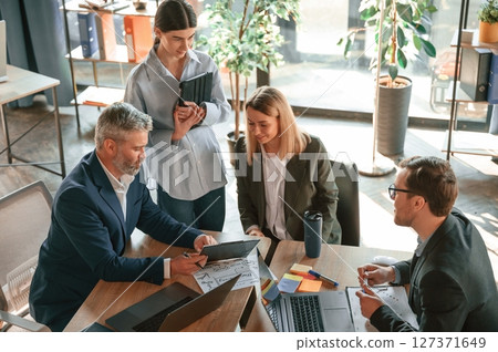 Cooperative business. Group of people are working in the modern office 127371649