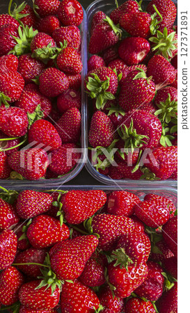 Ripe strawberries picked from the garden. In disposable containers. sale. Ripe strawberries picked from the garden. In disposable containers. sale. 127371891