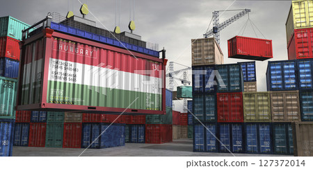 Cargo container with flag of Hungary lifted by crane at freight terminal - 3D illustration 127372014