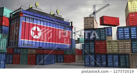 Cargo container with flag of North Korea lifted by crane at freight terminal - 3D illustration Cargo container with flag of North Korea lifted by crane at freight terminal - 3D illustration 127372019
