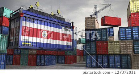 Cargo container with flag of Costa Rica lifted by crane at freight terminal - 3D illustration 127372031